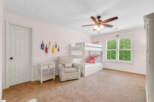 carpeted bedroom featuring visible vents, a ceiling fan, and baseboards