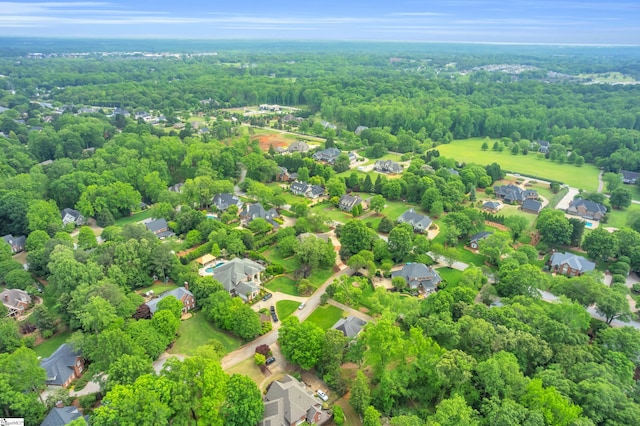 bird's eye view with a residential view and a wooded view