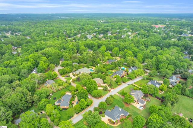 aerial view featuring a residential view and a wooded view
