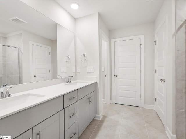 216 Merriweather Way, Spartanburg, SC 29302 - bathroom with double vanity, tile patterned floors, and a tile shower