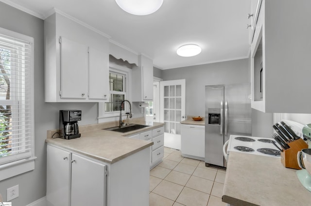 kitchen featuring white dishwasher, light tile patterned flooring, a sink, white cabinetry, and a peninsula
