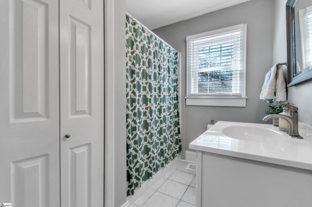 bathroom with tile patterned floors, vanity, and a shower with shower curtain