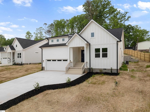 modern inspired farmhouse with board and batten siding, roof with shingles, a garage, fence, and concrete driveway
