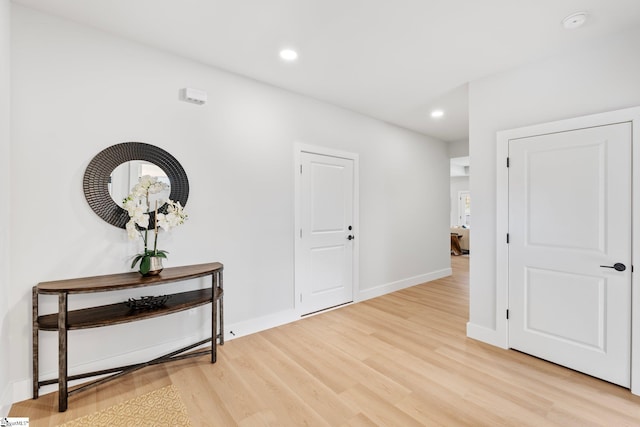 entrance foyer featuring recessed lighting, baseboards, and light wood finished floors