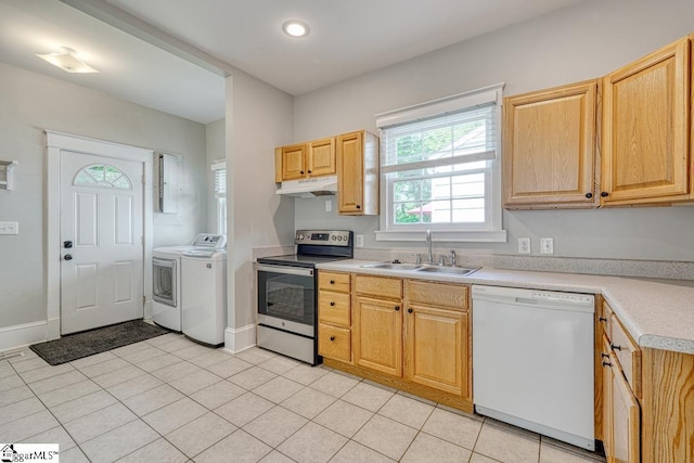 kitchen with washing machine and clothes dryer, white dishwasher, a sink, stainless steel range with electric stovetop, and under cabinet range hood