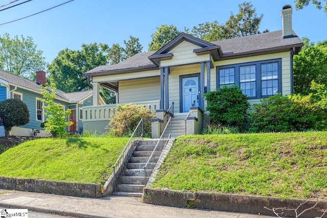 bungalow-style house featuring a chimney