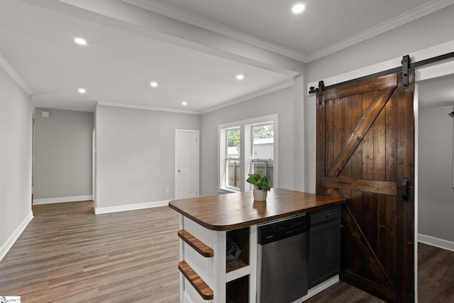 kitchen with butcher block countertops, dark wood-type flooring, a barn door, recessed lighting, and dishwasher