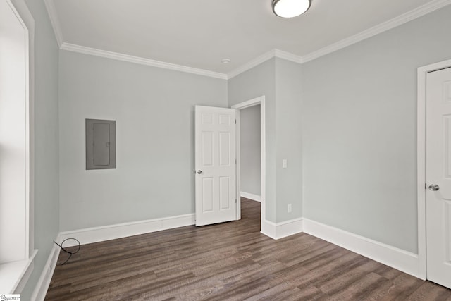 unfurnished bedroom with crown molding, baseboards, electric panel, and dark wood-type flooring