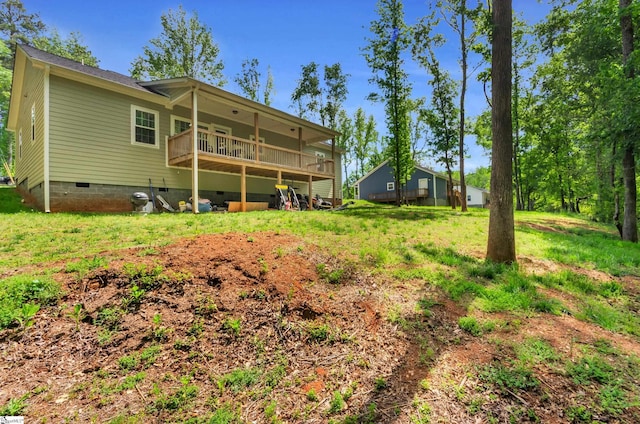 back of house with a wooden deck and crawl space