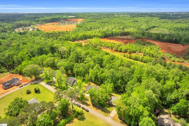 aerial view featuring a view of trees