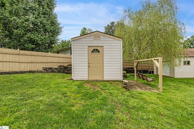view of shed featuring a fenced backyard