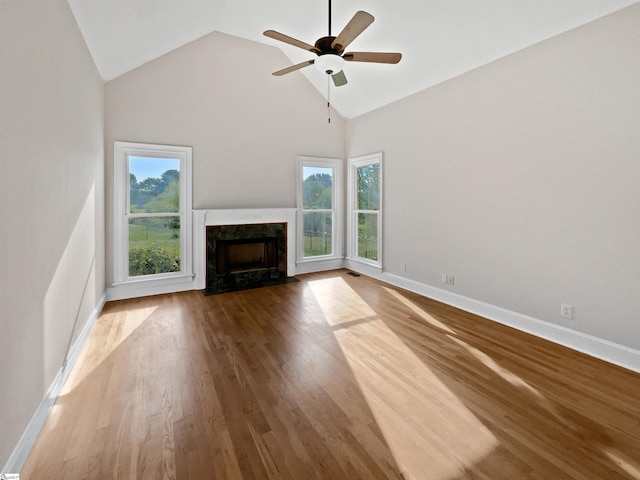 1611 Scuffletown Rd, Fountain Inn, SC 29644 - unfurnished living room featuring a high end fireplace, ceiling fan, a wealth of natural light, and high vaulted ceiling