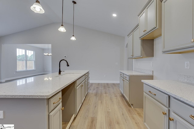 108 Walters Way, Pickens, SC 29671 - kitchen featuring a sink, vaulted ceiling, light wood-style flooring, light stone countertops, and an island with sink