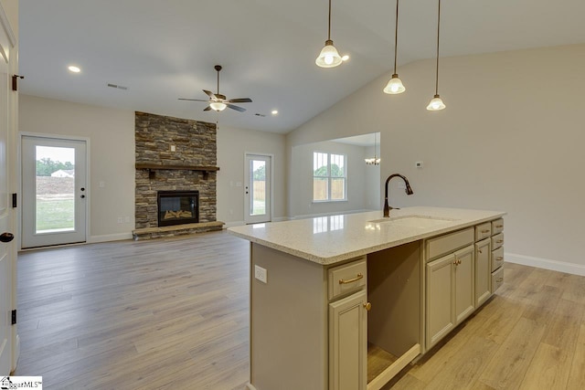 108 Walters Way, Pickens, SC 29671 - kitchen featuring a sink, ceiling fan, light wood finished floors, healthy amount of natural light, and vaulted ceiling