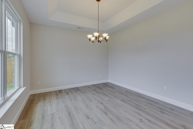 108 Walters Way, Pickens, SC 29671 - unfurnished room with wood finished floors, a chandelier, a raised ceiling, and baseboards