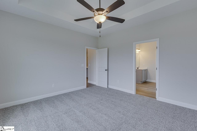 108 Walters Way, Pickens, SC 29671 - unfurnished bedroom featuring carpet, baseboards, a tray ceiling, and connected bathroom