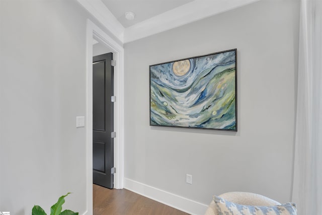 hallway with baseboards and wood finished floors