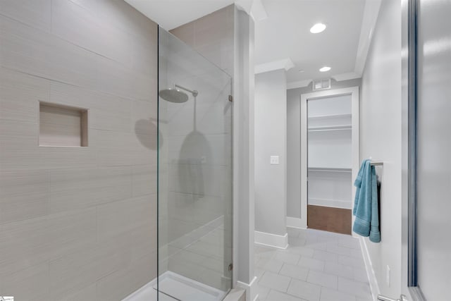 bathroom with visible vents, a stall shower, tile patterned floors, baseboards, and a spacious closet