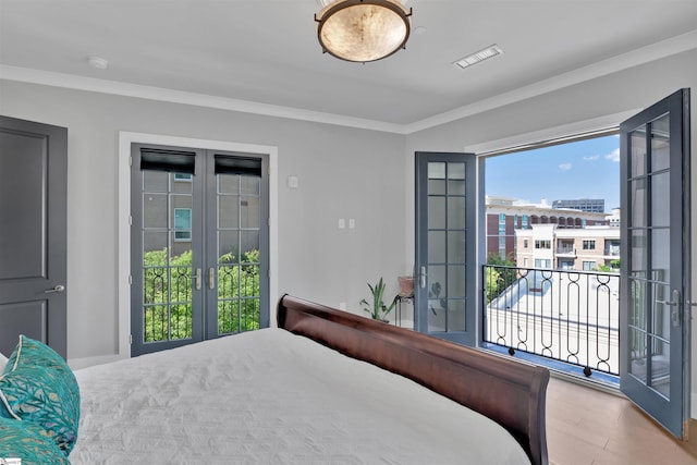 bedroom featuring french doors, multiple windows, and access to exterior