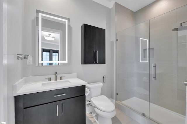 bathroom featuring vanity, toilet, and a shower stall