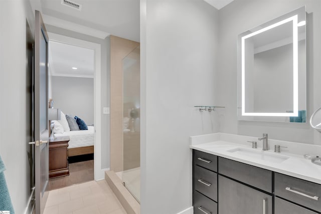 bathroom with visible vents, tile patterned flooring, a shower stall, vanity, and ensuite bathroom