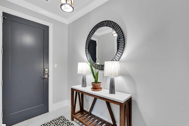 foyer with light tile patterned floors and baseboards