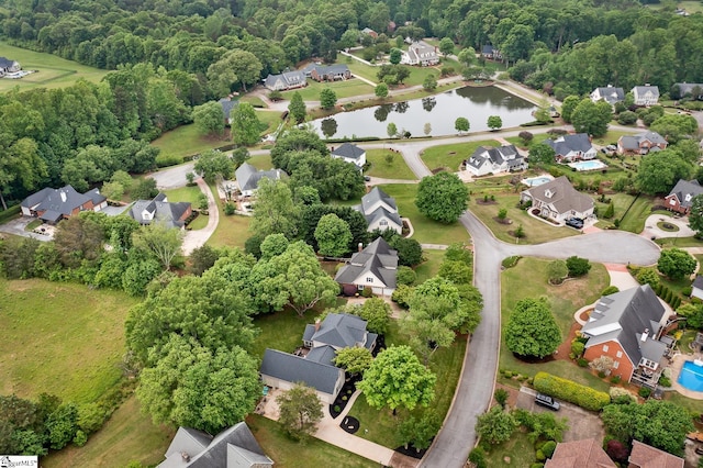 birds eye view of property featuring a water view and a residential view