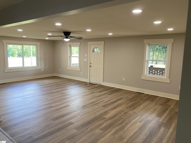 interior space with recessed lighting, baseboards, and dark wood finished floors