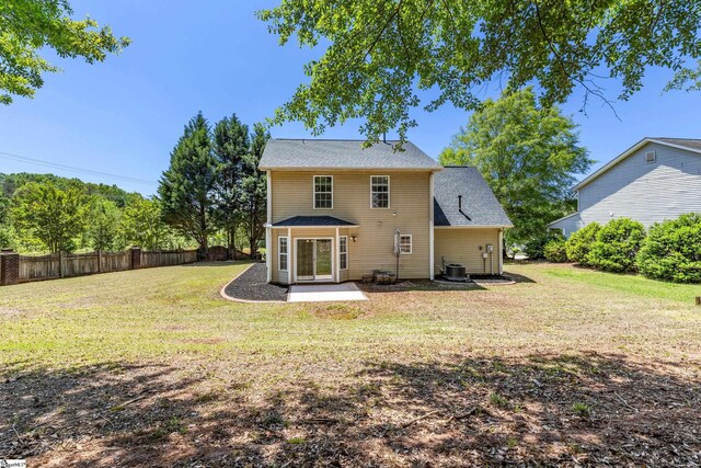 2 Susana Dr, Greer, SC 29651 - back of house featuring a yard, fence, central AC unit, and a patio area