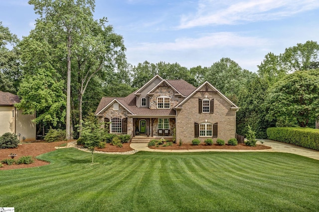 17 Avens Hill Dr, Greer, SC 29651 - view of front of property featuring covered porch, brick siding, a front lawn, and stone siding