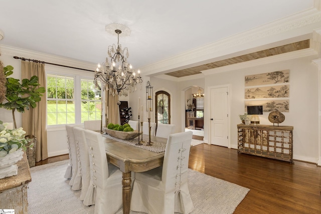 17 Avens Hill Dr, Greer, SC 29651 - dining area with crown molding, a notable chandelier, arched walkways, baseboards, and wood finished floors