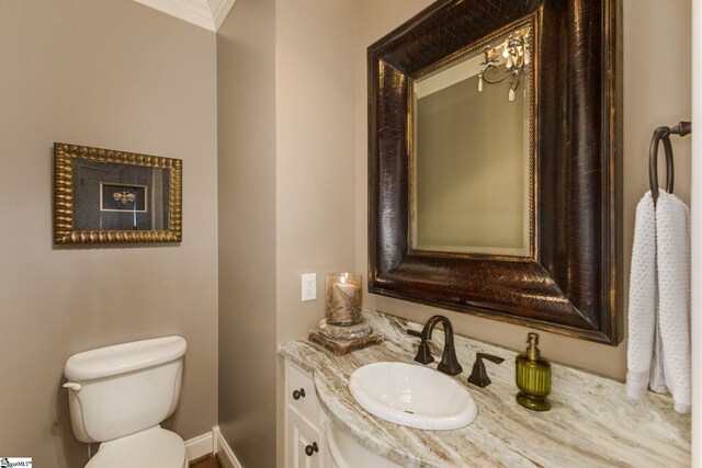 17 Avens Hill Dr, Greer, SC 29651 - half bathroom with crown molding, vanity, baseboards, toilet, and a notable chandelier
