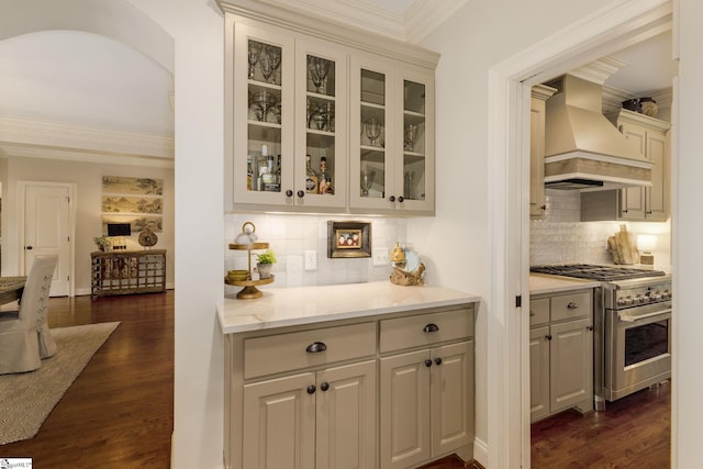 17 Avens Hill Dr, Greer, SC 29651 - bar with decorative backsplash, stainless steel range, dark wood-style floors, and premium range hood