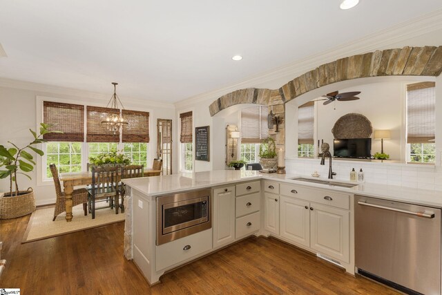 17 Avens Hill Dr, Greer, SC 29651 - kitchen with light countertops, appliances with stainless steel finishes, a sink, and dark wood-type flooring