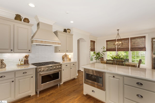 17 Avens Hill Dr, Greer, SC 29651 - kitchen featuring premium range hood, backsplash, and stainless steel appliances