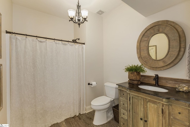 17 Avens Hill Dr, Greer, SC 29651 - full bathroom with visible vents, wood finished floors, vanity, toilet, and a notable chandelier