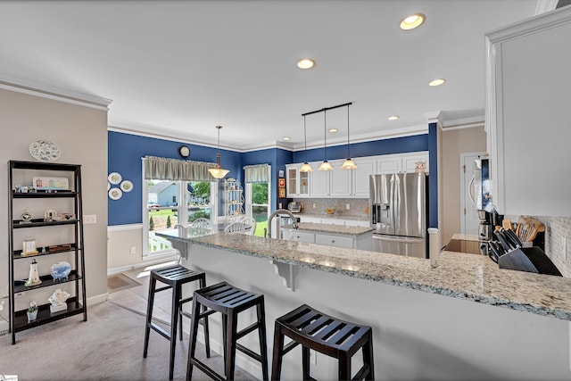 105 Chariot Ln, Simpsonville, SC 29681 - kitchen featuring glass insert cabinets, backsplash, a peninsula, stainless steel fridge, and white cabinetry