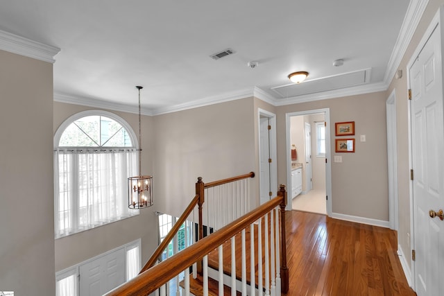 105 Chariot Ln, Simpsonville, SC 29681 - hallway with baseboards, attic access, a chandelier, hardwood / wood-style flooring, and an upstairs landing