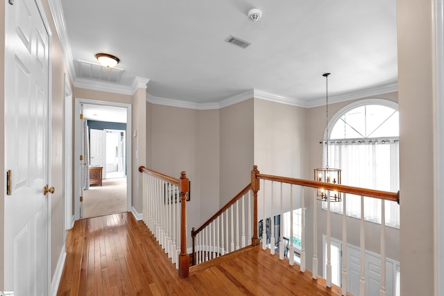 105 Chariot Ln, Simpsonville, SC 29681 - hallway with wood-type flooring, a chandelier, visible vents, and an upstairs landing