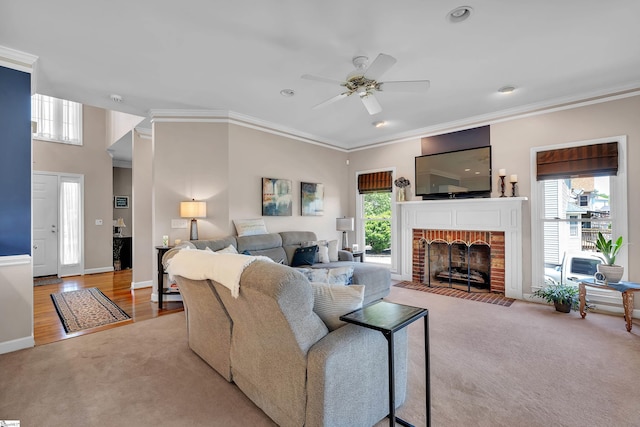 105 Chariot Ln, Simpsonville, SC 29681 - living area with a healthy amount of sunlight, ceiling fan, a brick fireplace, and crown molding