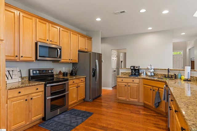 502 Kingsmoor Dr, Simpsonville, SC 29681 - kitchen featuring visible vents, light stone countertops, recessed lighting, a sink, and appliances with stainless steel finishes