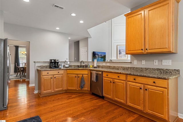 502 Kingsmoor Dr, Simpsonville, SC 29681 - kitchen featuring visible vents, appliances with stainless steel finishes, wood finished floors, stone countertops, and recessed lighting