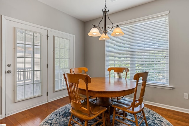 502 Kingsmoor Dr, Simpsonville, SC 29681 - dining room featuring baseboards, an inviting chandelier, and wood finished floors