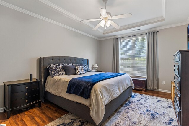 502 Kingsmoor Dr, Simpsonville, SC 29681 - bedroom featuring baseboards, ornamental molding, a raised ceiling, and dark wood-style floors