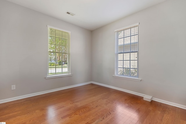 502 Kingsmoor Dr, Simpsonville, SC 29681 - spare room featuring visible vents, plenty of natural light, and wood finished floors