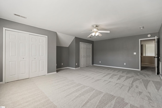 502 Kingsmoor Dr, Simpsonville, SC 29681 - unfurnished bedroom with light colored carpet, multiple closets, visible vents, and baseboards