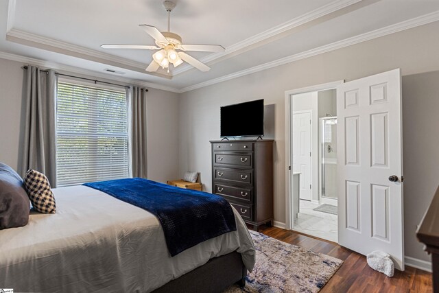 502 Kingsmoor Dr, Simpsonville, SC 29681 - bedroom featuring dark wood-type flooring, ornamental molding, a raised ceiling, and ensuite bathroom