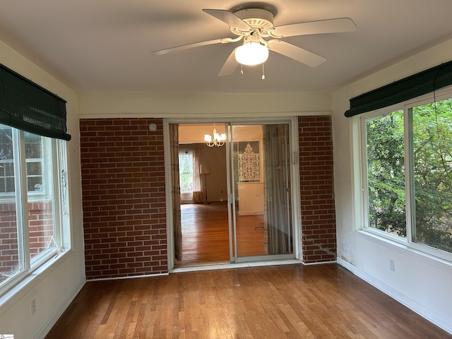 402 Chestnut St, Clinton, SC 29325 - unfurnished sunroom with a notable chandelier and a wealth of natural light