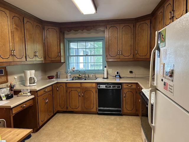 402 Chestnut St, Clinton, SC 29325 - kitchen featuring a sink, dishwasher, light countertops, freestanding refrigerator, and range with electric stovetop