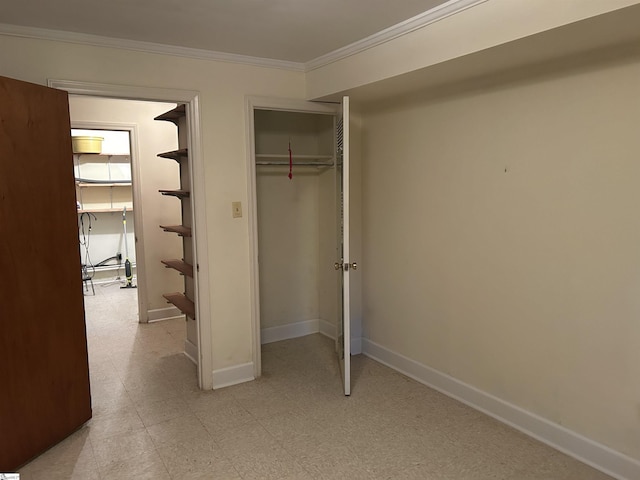 402 Chestnut St, Clinton, SC 29325 - unfurnished bedroom featuring baseboards, ornamental molding, and a closet